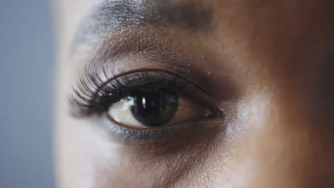 Optometry, eye care and face of black woman in studio with contact lenses for Stock Footage 331184285