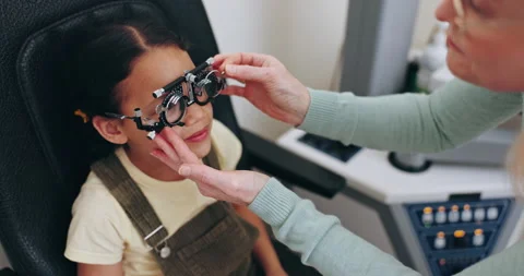 Optometry, glasses and optician with frame for child for testing vision, sight Video stock 255388576