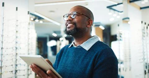 Optometry, happy and man on tablet for store inventory, inspection and checklist Stock Photos