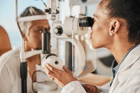 Optometry, ophthalmology and eye exam by optometrist with a patient senior woman Stock Photos
