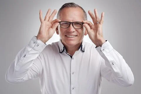 Optometry, portrait or man in studio with glasses, optical satisfaction or .. Stock Photos