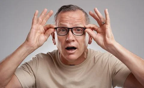 Optometry, portrait or person in studio with glasses, optical surprise or g.. Stock Photos