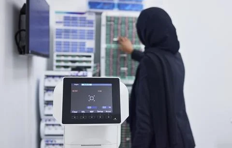 Optometry, screen for eye exam and Muslim optician with machine for vision test Stock Photos