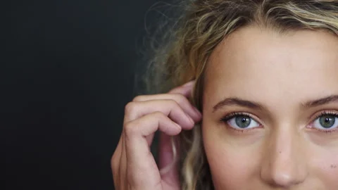 Optometry, space and face of woman in studio with contact lenses for Stock Footage 331335832
