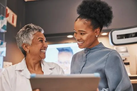 Optometry, tablet and optometrist talking to a patient about eye test results or Stock Photos