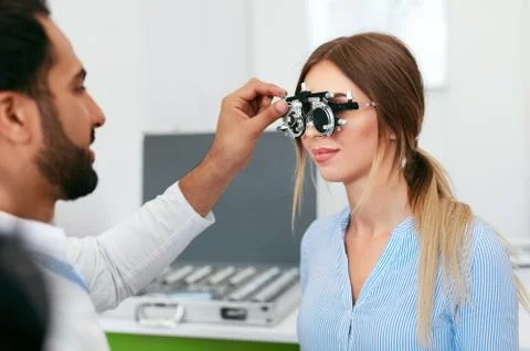Optometry Test. Eye Doctor Checking Woman Eyesight At Clinic Stock Photos