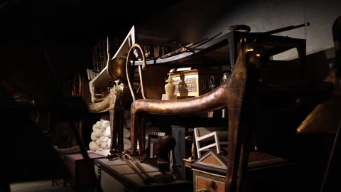 An opulent collection of ancient Egyptian artifacts, including ceremonial beds,  Stock Footage 301791936