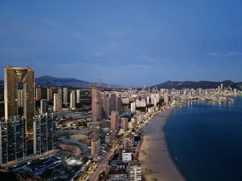 Opulent elevated position offering comprehensive views of illuminated shoreline Stock Photos