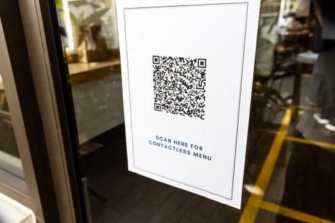 OR code Contactless menu displayed on restaurant door with new normal. Code i Stock Photos