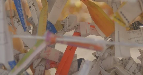 Oracle on the string at Asakusa shrine middle shot back rack focus Stock Footage 97300896