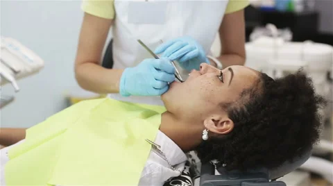 Oral hygiene, dental care: Doctor dentist working with patient in dental clinic Stock Footage