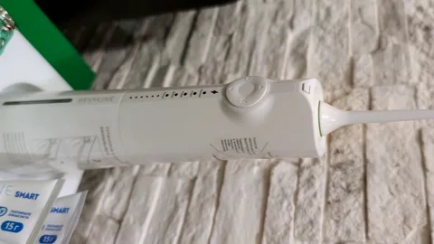 Oral irrigator on table Stock-Footage 283574834