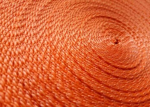 Orange abstract background. Circular pattern of orange sling Stock Photos