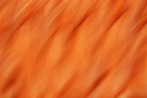 Orange abstract background with diagonal brushed texture conveying warm vibrant Stock Photos
