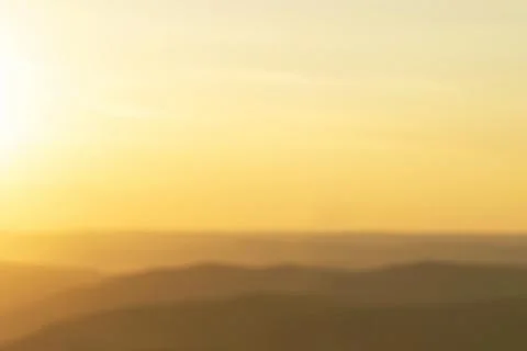 Orange abstract background - evening sunset in the mountains yellow nature Stock Photos