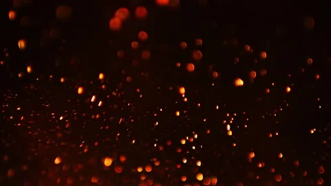 Orange abstract glowing rising particles, slow motion, on black background Stock Footage 168763822