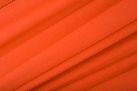 Orange abstract textured background with stripes. Flat lay, copy space Stock Photos