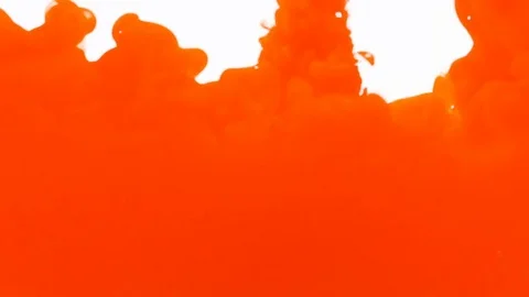 Orange acrylic paint ink dropping and blending with water abstract background Video stock 79780500
