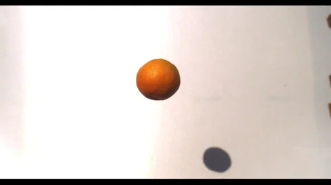 ORANGE IN THE AIR SLOW MOTION Stock Footage 25454522