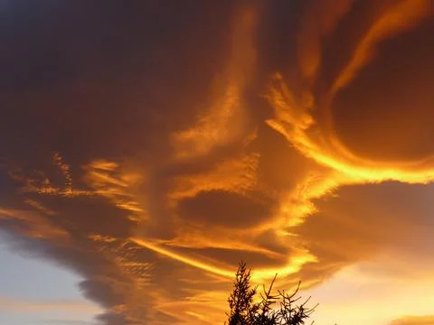 Orange alienlike Lenticular cloud, Altocumulus lenticularis Stock Photos