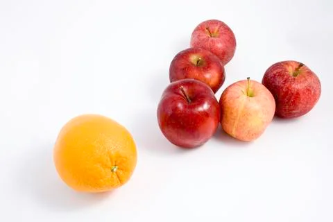 An Orange among Apples Stock Photos