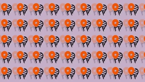 Orange and Black Balloons Pattern on Light Purple Background. Stock Footage 325389193