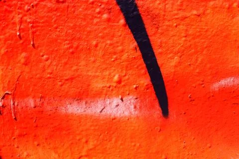 Orange and black sprayed wall a bit dark texture Stock Photos