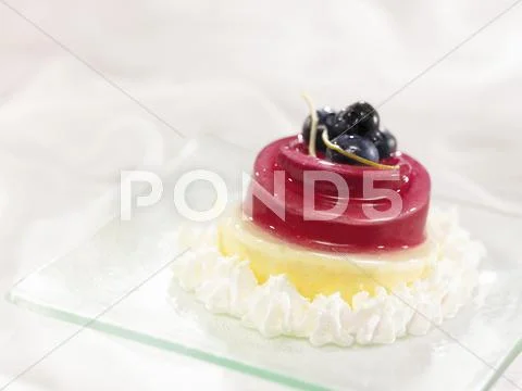 Orange and blueberry dessert with cream Stock Photos