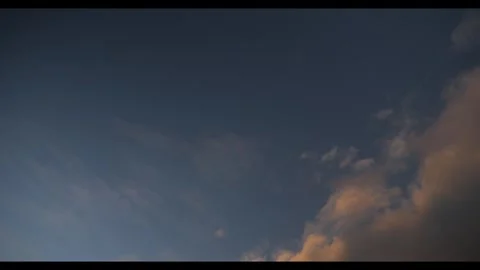 Orange and grey clouds, dark blue sky, 4k, 24fps, 709 colour profile Stock Footage 277226939