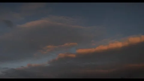 Orange and grey clouds during evening version 2, 24fps, 4k, 709 colour profile Stock Footage 277226957