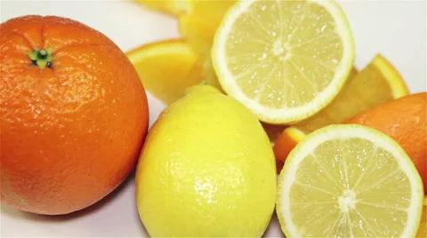 Orange and lemon rotation on the table, close-up Stock Footage 60066052