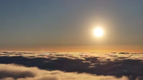 Orange and pink cloudscape blanket reveals twliight hour cloudscape Stock Footage 337143992