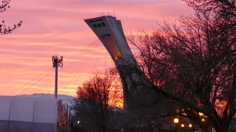 Orange and pink sky and olympic stadium in montreal Stock Footage 139664433