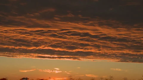 Orange and purple clouds at sunset Vídeo Stock 3976021