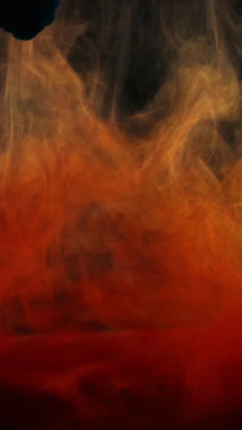 Orange and red ink clouds swirling in clear water creating abstract flowing Video stock 347692381