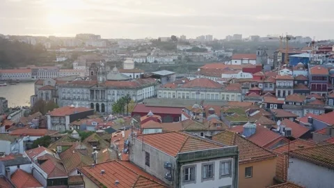 Orange and red tile roofs of buildings overlooking the Douro river in Porto Stock Footage 293494795