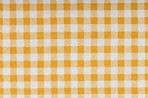 Orange and white checkered, pattern, design, cotton fabric for sewing, textur Stock Photos