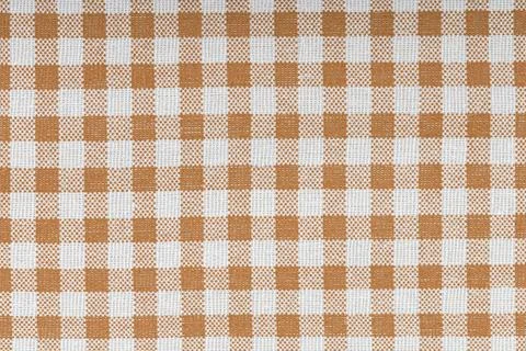 Orange and white checkered, pattern, design, cotton fabric for sewing, textur Stock Photos