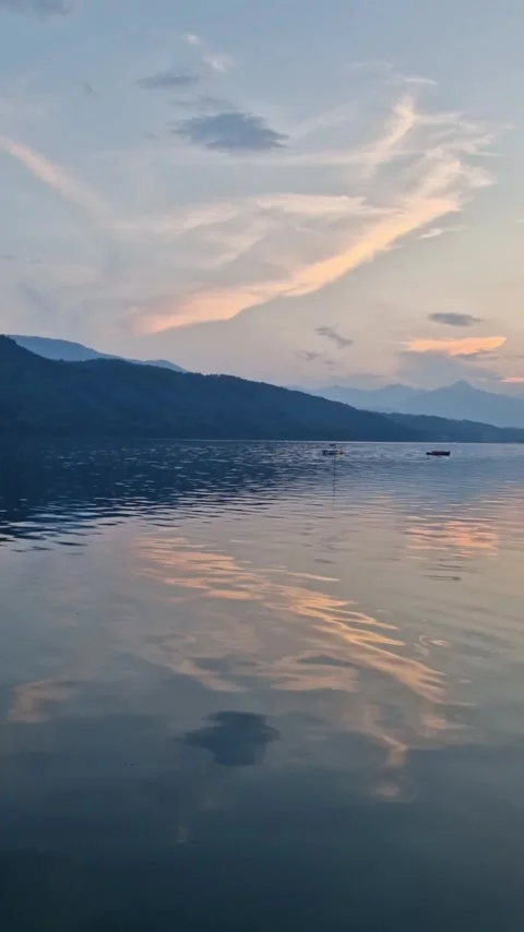 Orange and White Cloud Reflection on Lake Surface Video stock 316062125