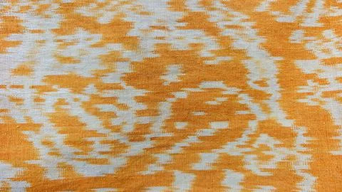 Orange and White Ikat Pattern Fabric Texture with Abstract Geometric Weave Stock Photos