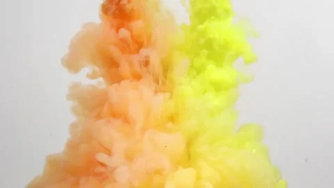 Orange and Yellow Cloud of Ink Blossoms Underwater Stock Footage 274526536