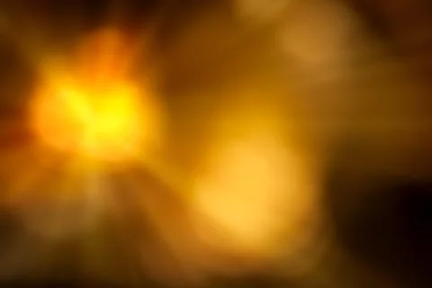 Orange and yellow gradient background. Blurred sunny abstract background. Stock Photos