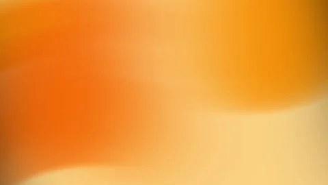 Orange and yellow gradients create a smooth blurred background. Stock Footage 310046917