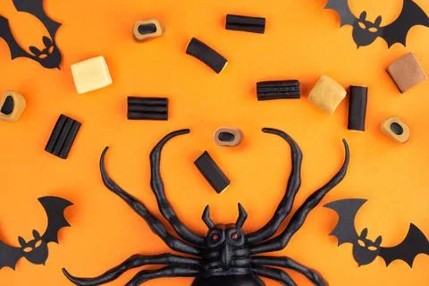 On an orange background below in the center of the spider, there are lacquer, Stock Photos