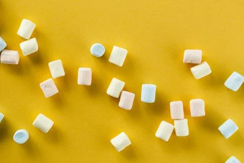 Orange background with colourful marshmallows Stock Photos