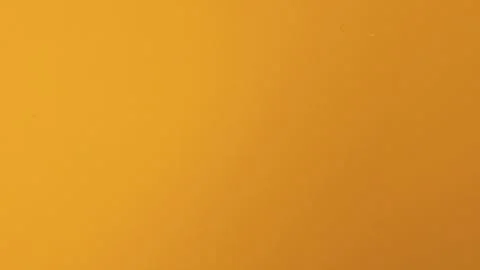 Orange background with some smooth lines in it. Stock Photos