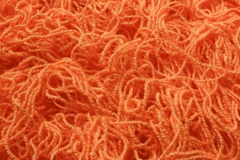 Orange background with texture of yarn Stock Photos