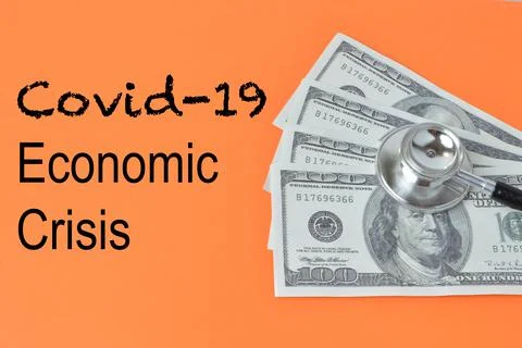 Orange background written with text COVID-19 ECONOMIC CRISIS. Foto stock