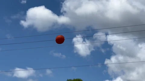 Orange ball on electrical wire Video stock 279191898