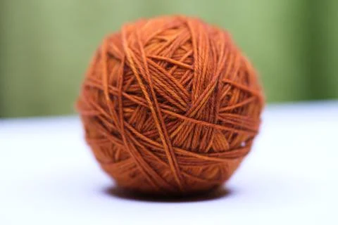 Orange ball of wool Stock Photos